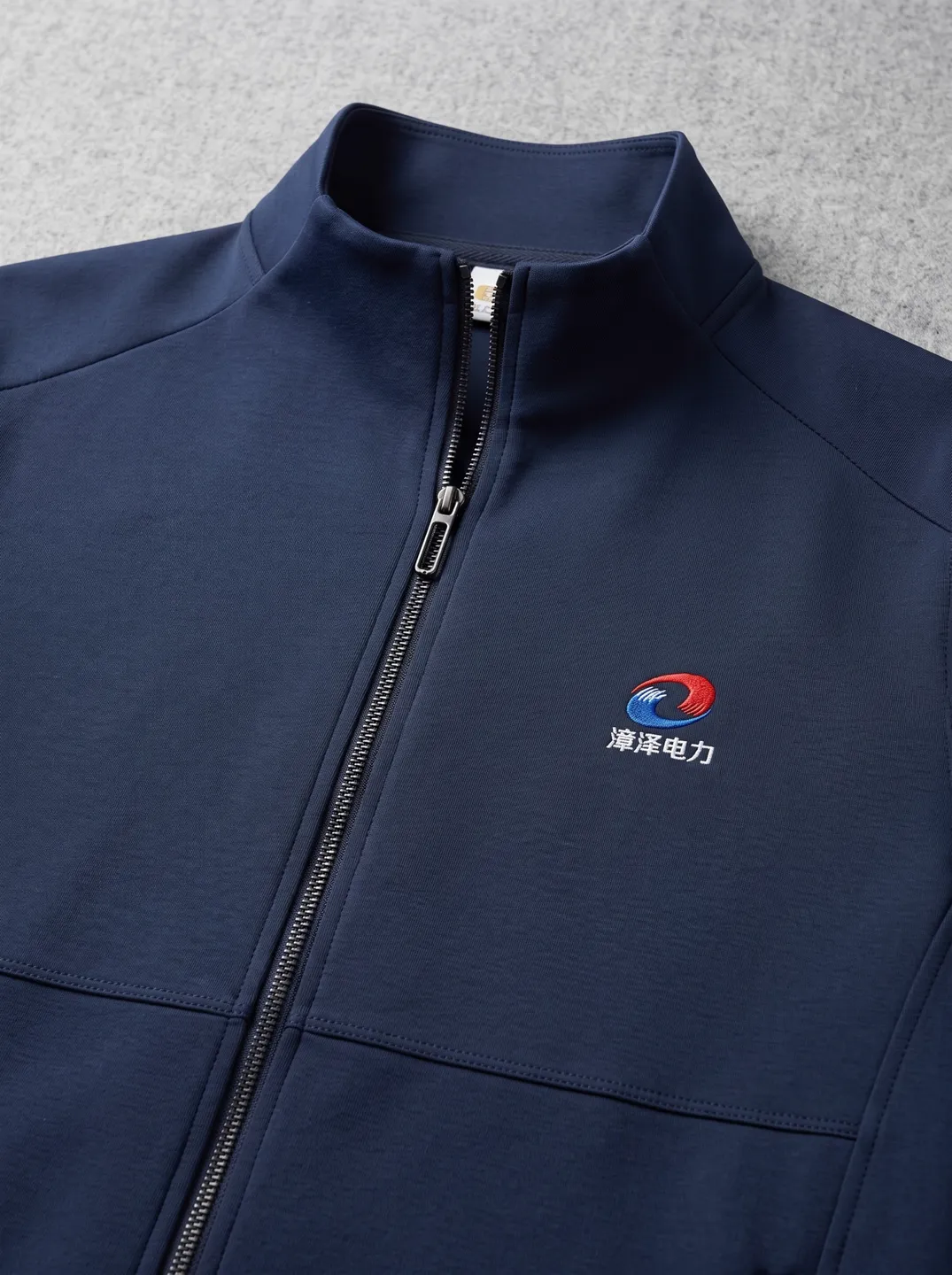 Navy Stand-Collar Zip Jacket · Logo and design details · PM-C-010 / 4