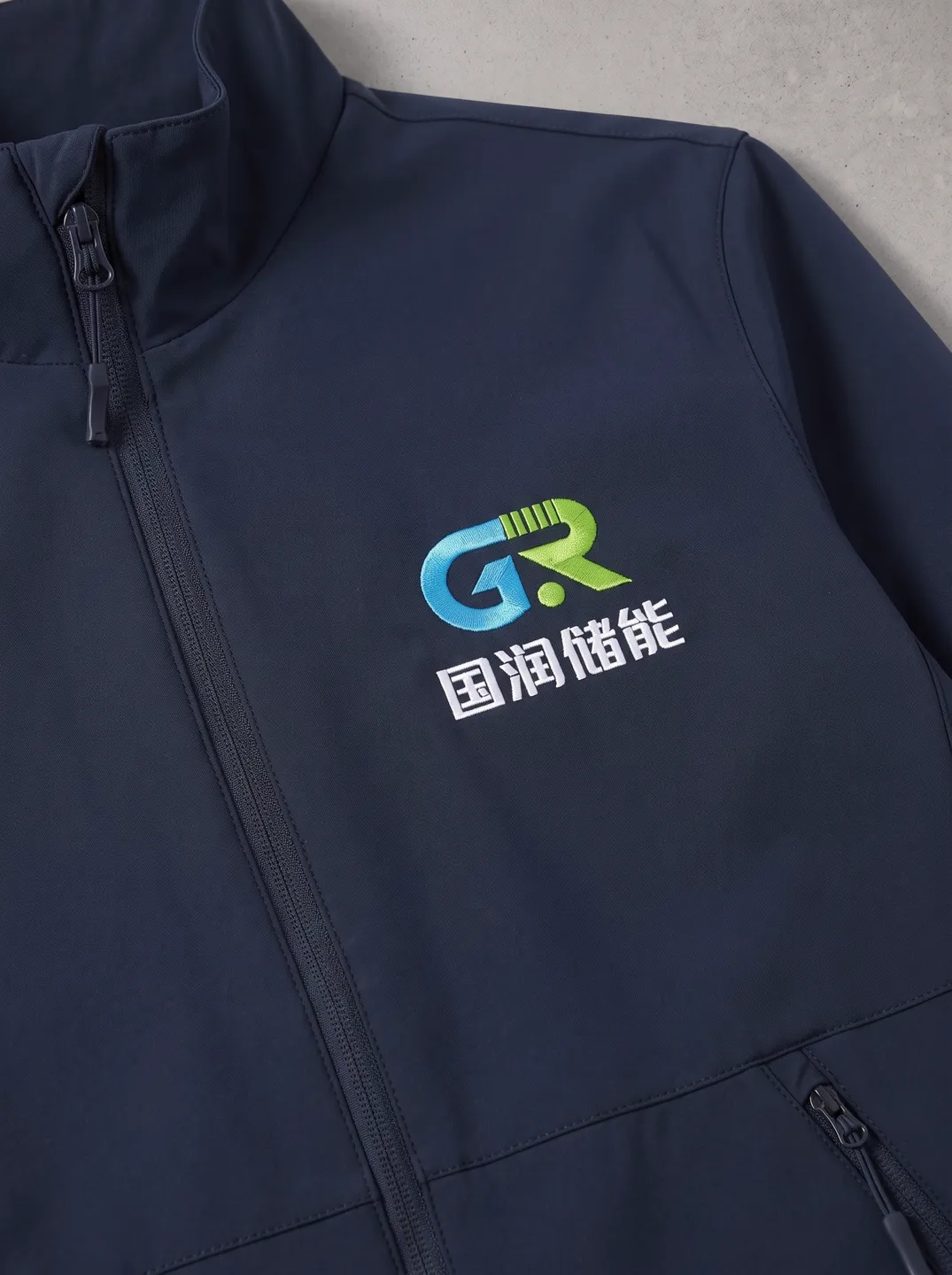 Navy Stand-Collar Zip Jacket · Logo and design details · PM-C-014 / 3