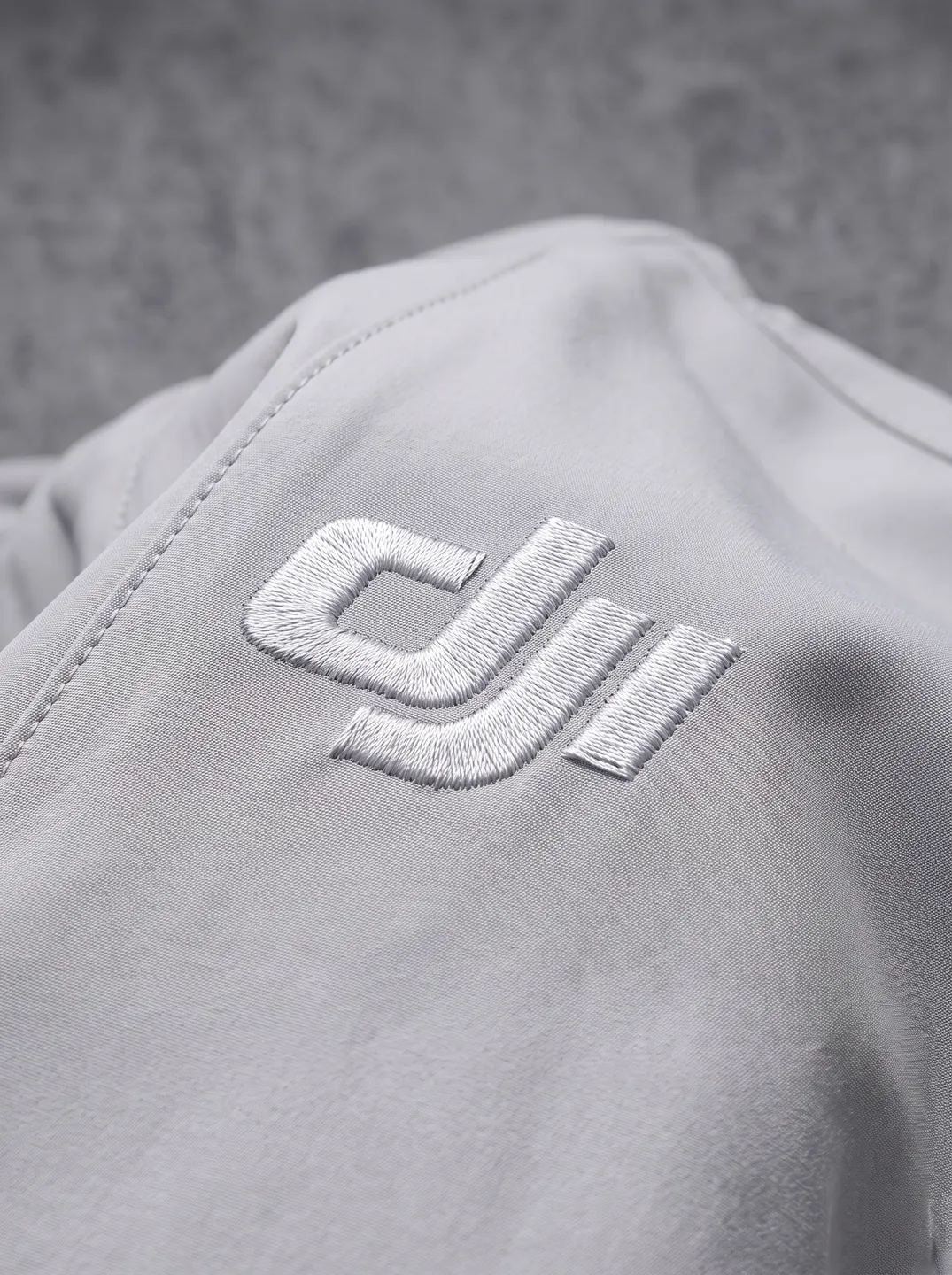 Light Grey Stand-Collar Zip Jacket · Logo and design details · PM-C-015 / 2