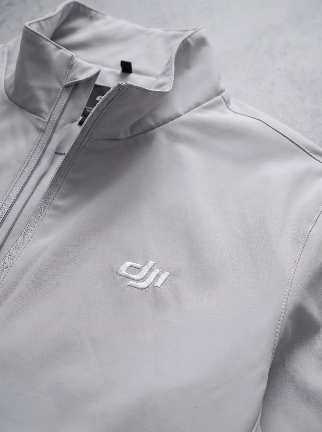Light Grey Stand-Collar Zip Jacket · Logo and design details · PM-C-015 / 3