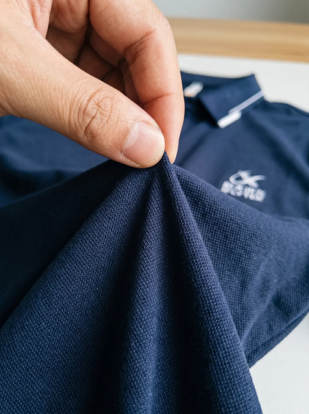 Navy Polo Shirt · Logo and design details · PM-C-067 / 4