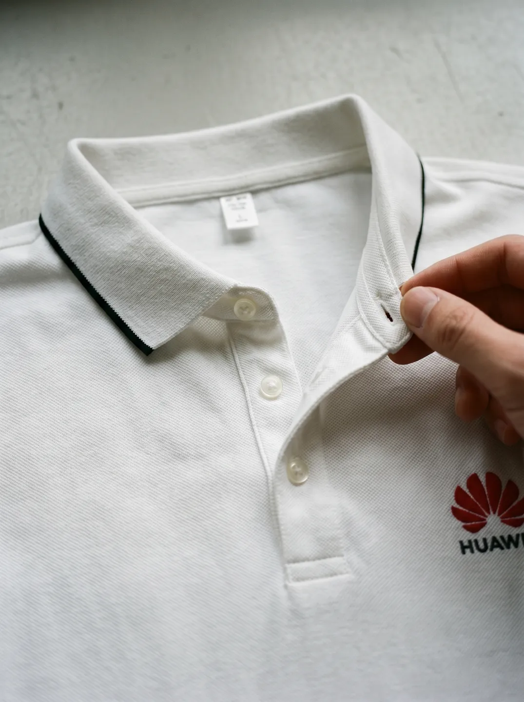 White Polo Shirt · Logo and design details · PM-C-068 / 3