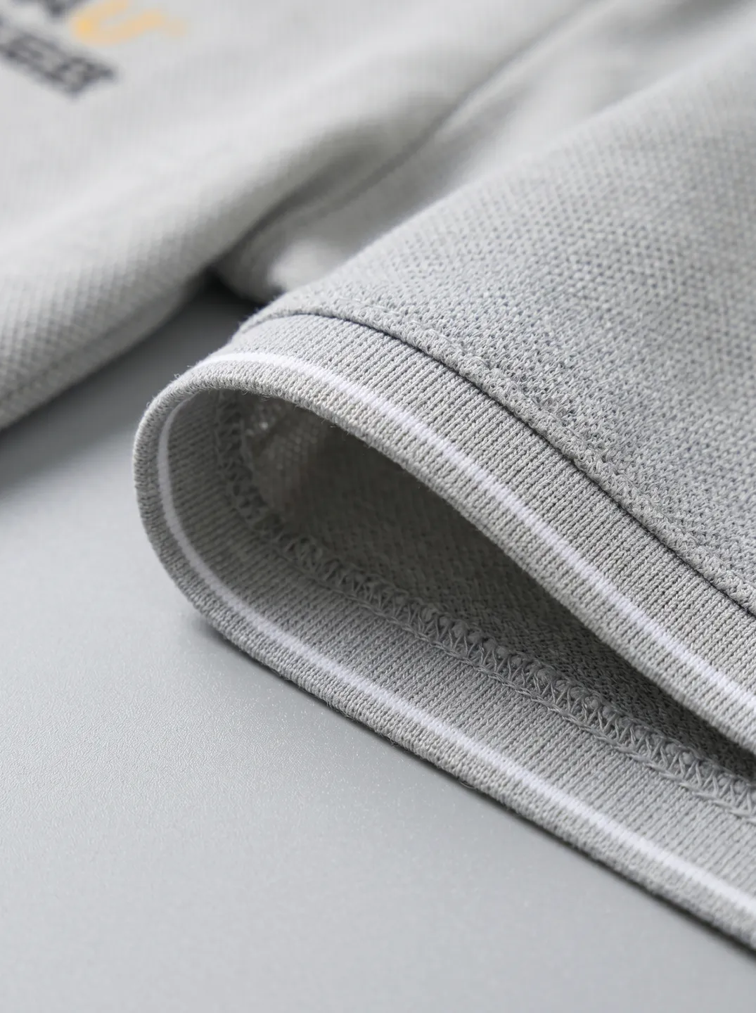 Light Grey Polo Shirt · Logo and design details · PM-C-077 / 4