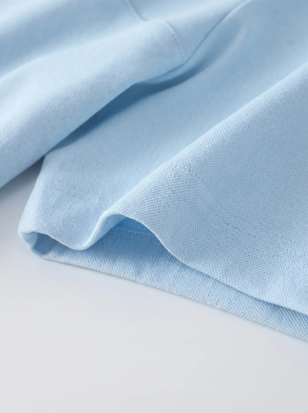 Light Blue Zip-Neck Polo Shirt · Logo and design details · PM-C-084 / 4
