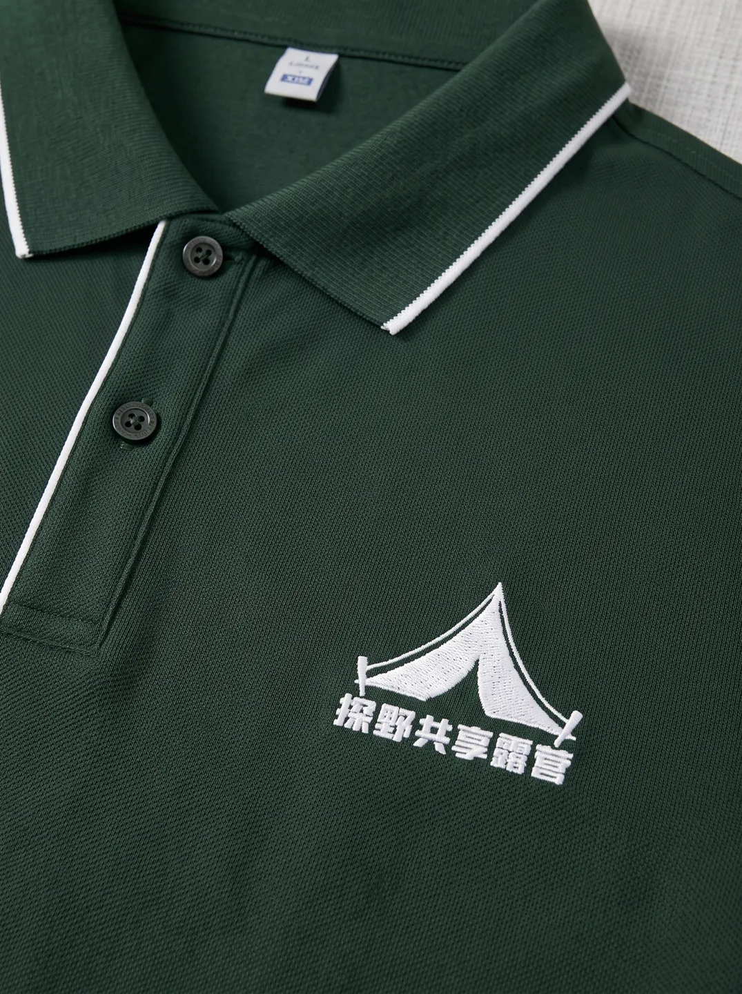 Poloshirt · Dunkelgrün · Logo- und Designdetails · PM-C-120 / 3