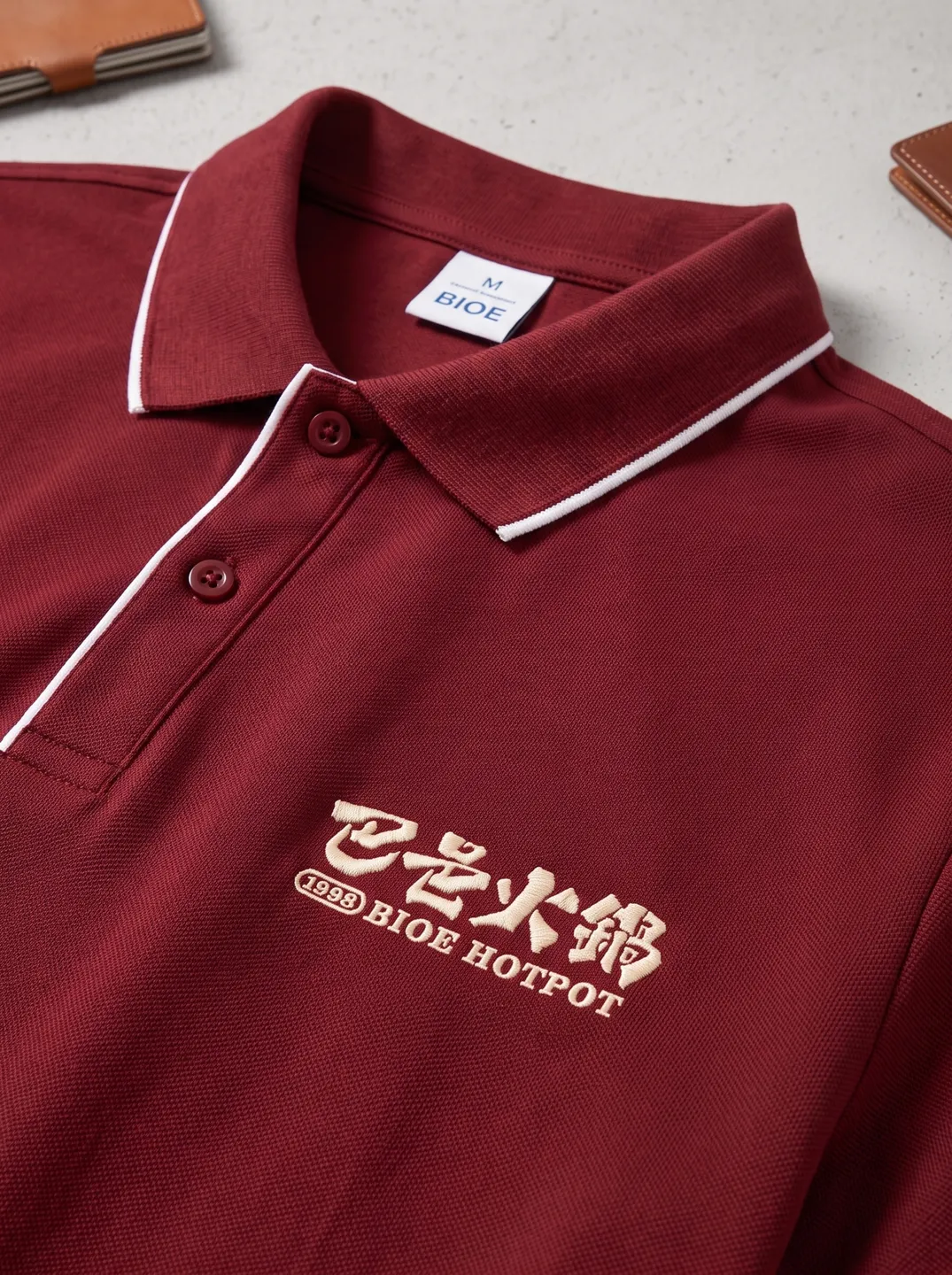 Burgundy Polo Shirt · Logo and design details · PM-C-124 / 3