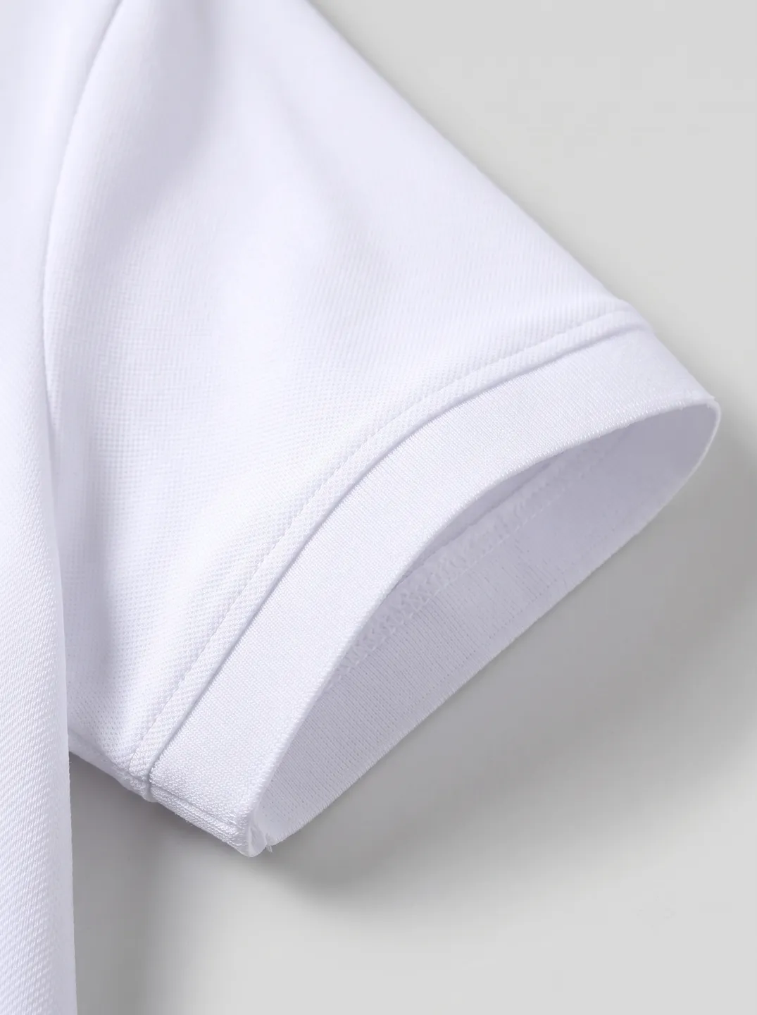 White Polo Shirt · Logo and design details · PM-C-128 / 4