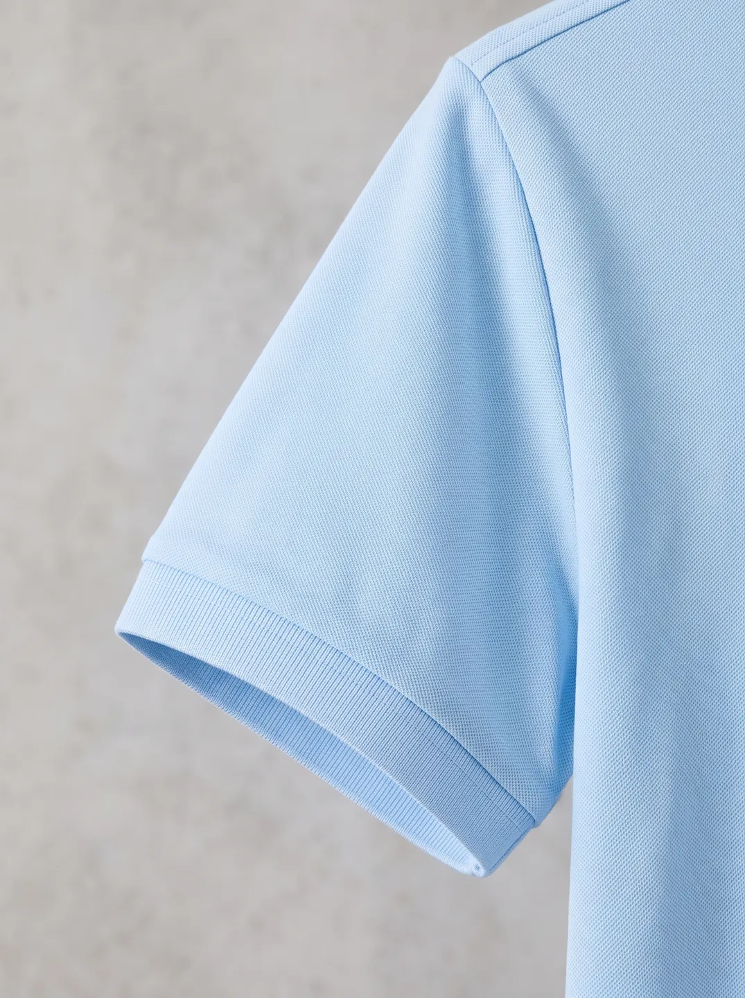 Light Blue Polo Shirt · Logo and design details · PM-C-129 / 4
