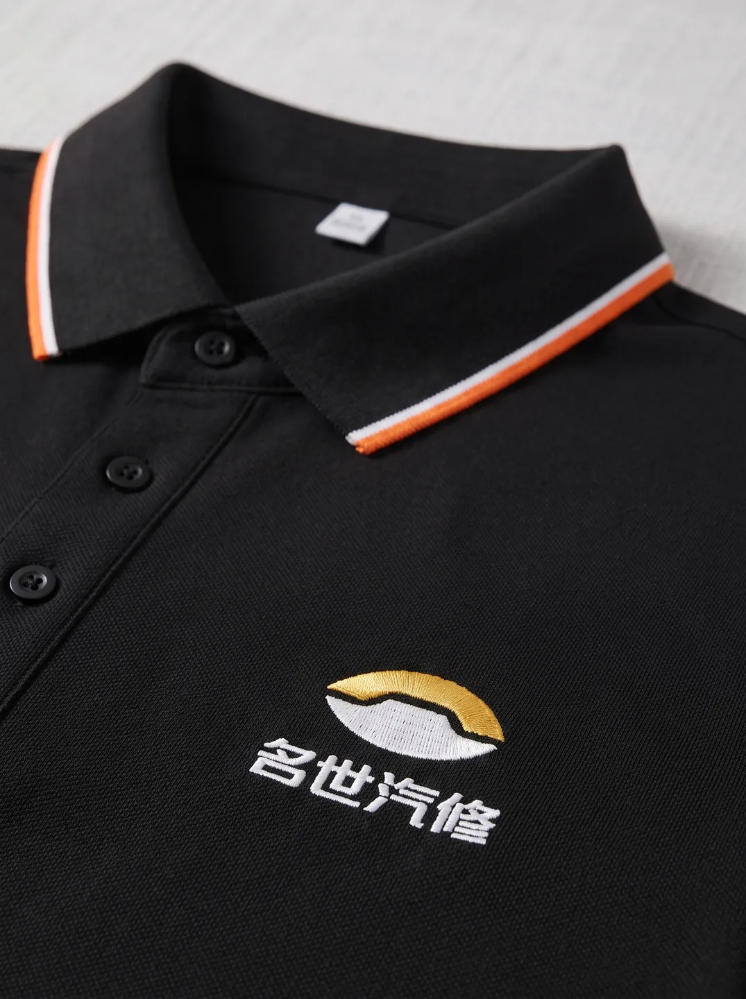 Black Polo Shirt · Logo and design details · PM-C-134 / 3