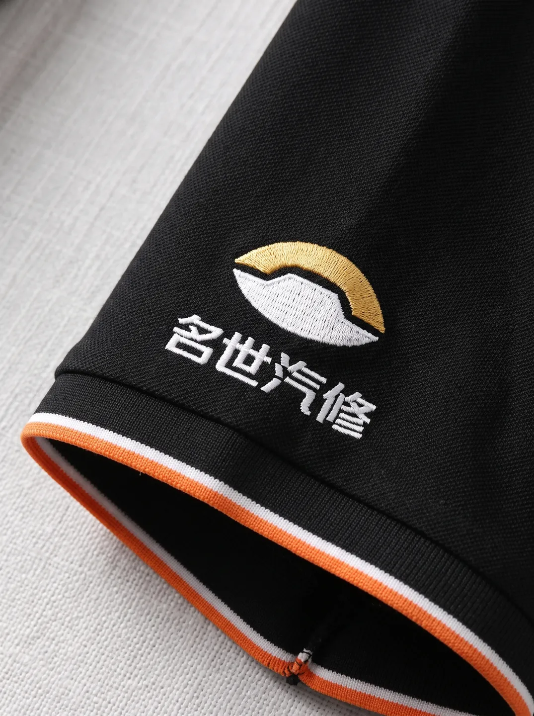Black Polo Shirt · Logo and design details · PM-C-134 / 4