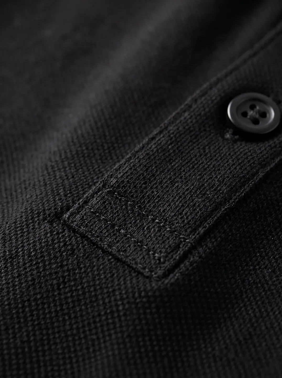 Black Polo Shirt · Logo and design details · PM-C-138 / 5