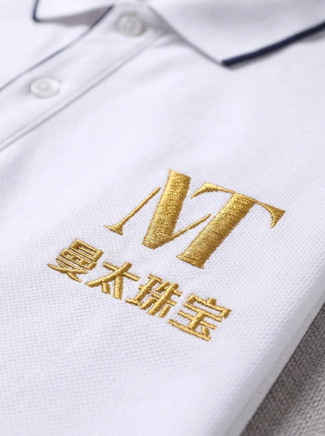 White Zip-Neck Polo Shirt · Logo and design details · PM-C-144 / 2