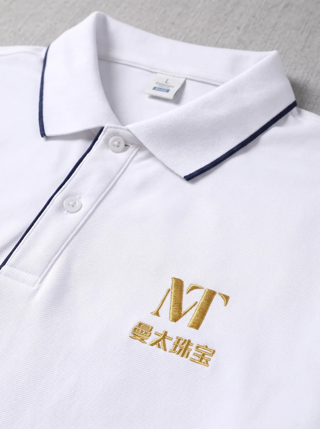 White Zip-Neck Polo Shirt · Logo and design details · PM-C-144 / 3