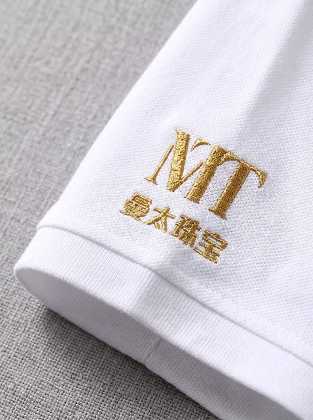 White Zip-Neck Polo Shirt · Logo and design details · PM-C-144 / 4