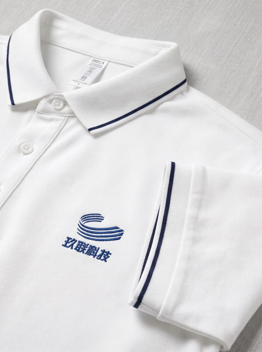White Polo Shirt · Logo and design details · PM-C-148 / 2