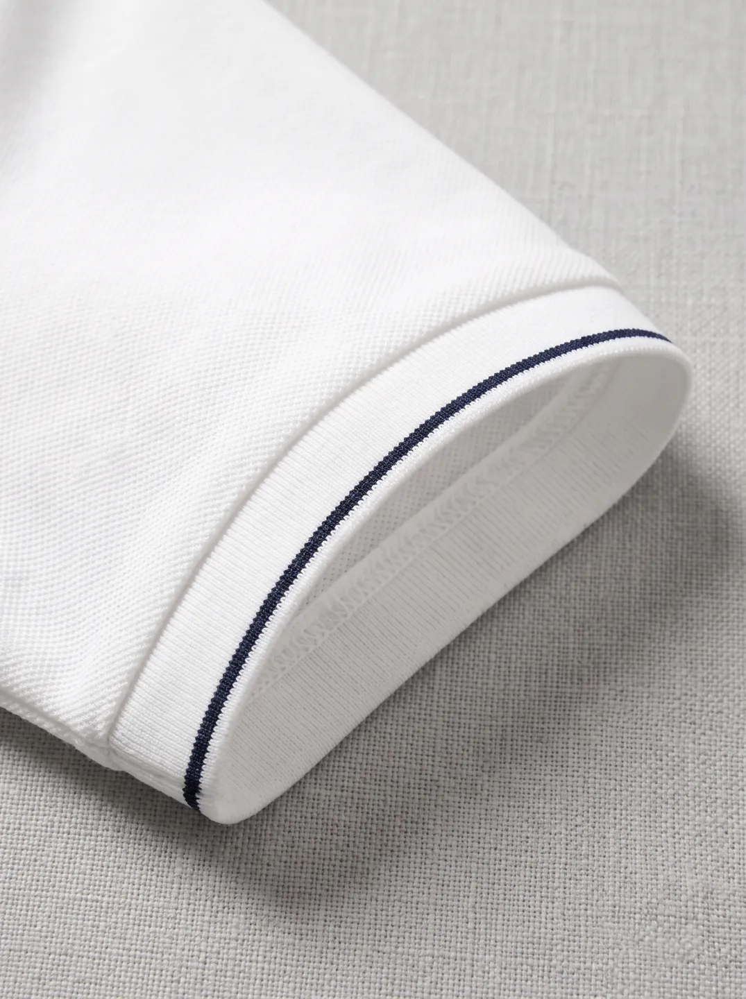 White Polo Shirt · Logo and design details · PM-C-148 / 4