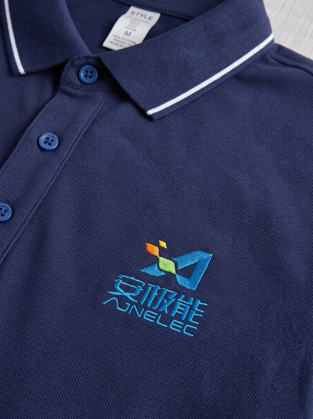 Navy Polo Shirt · Logo and design details · PM-C-150 / 3