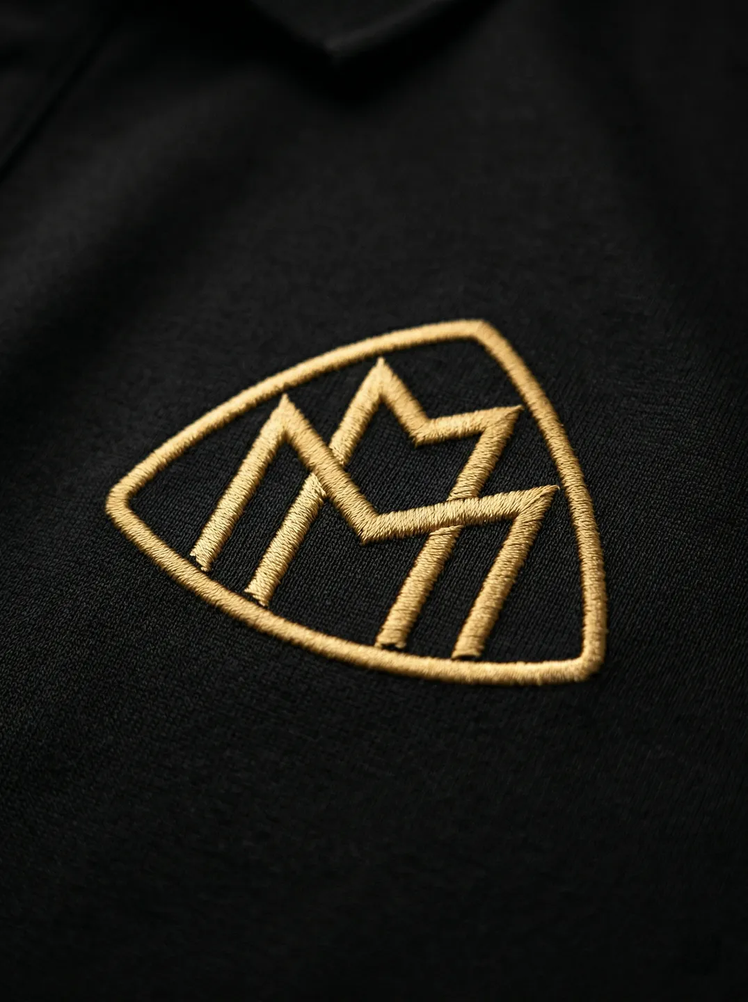 Black Polo Shirt · Logo and design details · PM-C-167 / 2